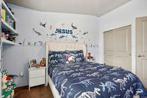 Carpeted bedroom featuring a closet