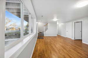 Unfurnished living room with hardwood / wood-style flooring