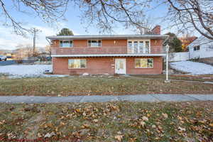 View of front of property featuring a yard