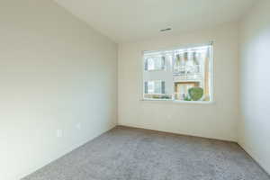 Empty room with carpet floors