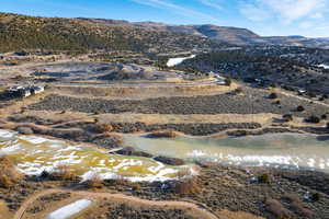 Property view of mountains with a water view