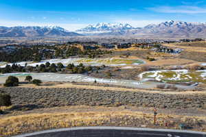 Property view of mountains featuring a water view