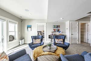 Living room featuring light colored carpet