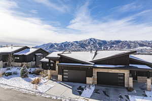 Ranch-style home with a mountain view and a garage