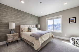 Carpeted bedroom featuring a mountain view