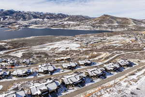 Snowy aerial view featuring a mountain view