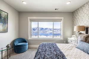 Bedroom featuring a mountain view and carpet floors