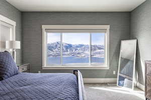 Carpeted bedroom featuring a mountain view