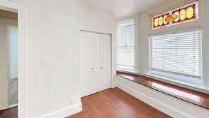 Corridor featuring dark wood-type flooring