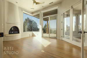 Office with hardwood flooring and lots of views.