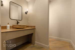 Bathroom featuring vanity and hardwood floors