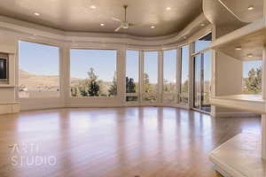 Greatroom with ceiling fan, a textured ceiling, and light hardwood floors and great views!