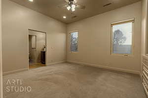 Guest bedroom with light colored carpet