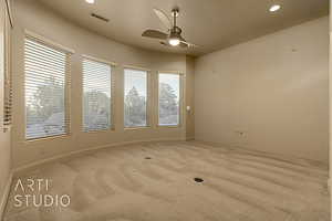 Bedroom featuring light carpet and ceiling fan