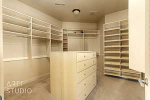 Walk in closet with adjustable shelving.