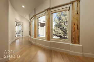 Hallway featuring light hardwood flooring.