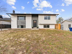 Split foyer home with a front yard