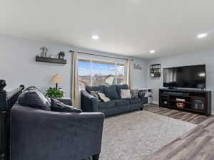 Living room with hardwood / wood-style flooring