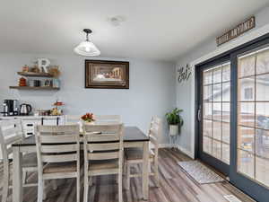 Dining space featuring hardwood / wood-style flooring