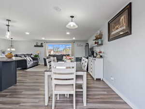 Dining room with hardwood / wood-style flooring