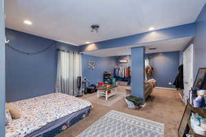 View of carpeted bedroom