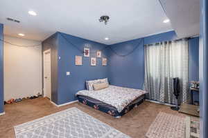 View of carpeted bedroom