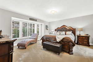 View of carpeted bedroom