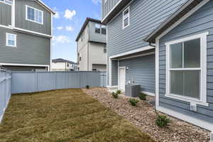 View of yard featuring central AC unit