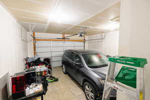 Garage featuring a garage door opener