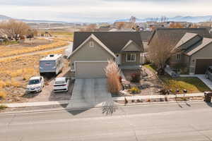 Single story home with a mountain view and a garage