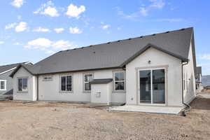 Back of property featuring a patio area