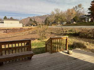 Wooden terrace featuring a mountain view