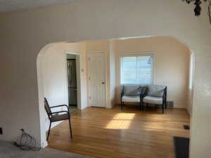 Living area with hardwood / wood-style floors