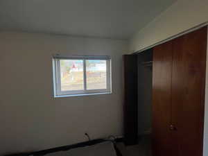 Unfurnished bedroom featuring a closet