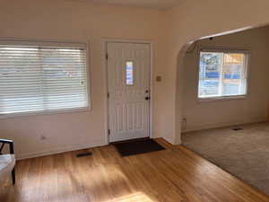 Foyer entrance featuring light hardwood / wood-style flooring