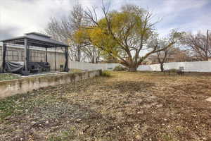 Back yard. Gazebo stays. Vinyl Fencing