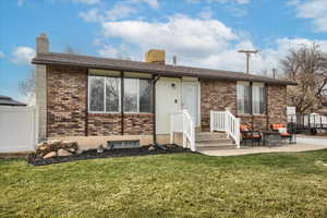 Ranch-style home with a patio area and a front lawn