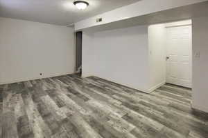 Basement with new wood-type flooring