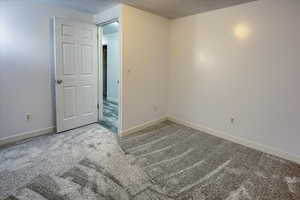 Unfurnished room with new light gray carpet and a textured ceiling