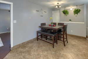 Dining room featuring a chandelier and light wood-type flooring