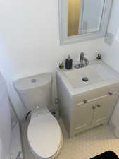 Bathroom featuring vanity and toilet