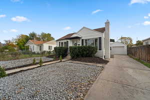 View of front of house featuring an outbuilding and a garage