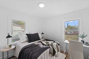 Bedroom with hardwood / wood-style floors