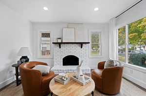 Living room featuring a fireplace and hardwood / wood-style floors