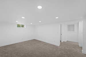 Basement with light carpet