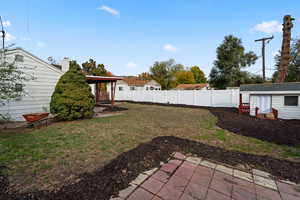 View of yard with an outbuilding