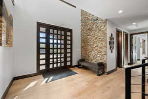 Foyer entrance with light hardwood / wood-style flooring