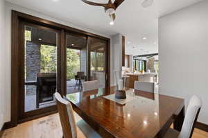 Dining room featuring plenty of natural light, ceiling fan, and light wood-type flooring