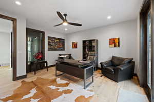 Interior space with light hardwood / wood-style flooring and ceiling fan