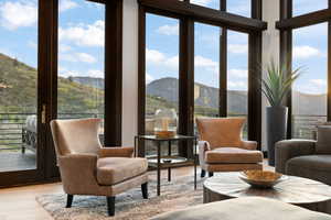 Sunroom / solarium with a mountain view